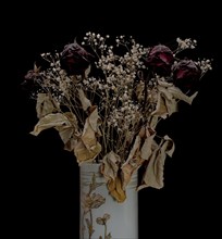 Dried bouquet of roses in a vase