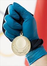 Person holding medal close up