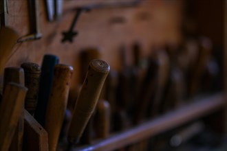 Tool set of expert violin maker luthier artisan workshop in Cremona