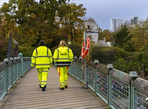 Two people in yellow protective clothing