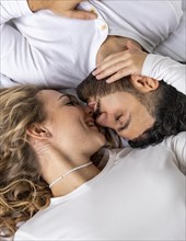 Couple kissing bed home
