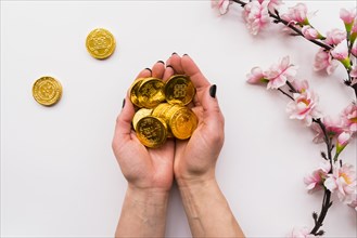 Chinese new year concept with hands holding coins