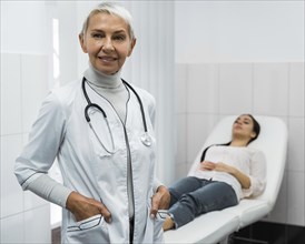 Female doctor posing patient