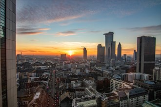 Sunset between skyscrapers. Cityscape with modern office buildings and streets. Insurance companies and banks as a cityscape in Frankfurt am Main