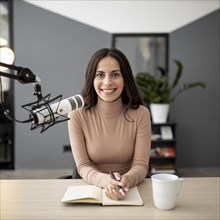 Front view smiley woman with microphone radio studio