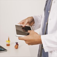 Doctor s hands working with tablet