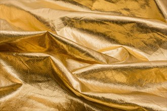 Close up wrinkled golden material
