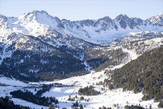 Panoramic of the snow-capped Pyrenees mountains in Andorra during winter