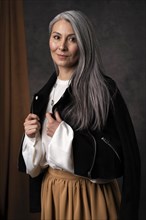 Beautiful senior woman portrait wearing black jacket