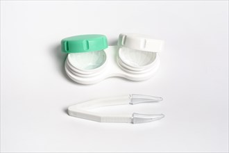 High angle case contact lenses with tweezers