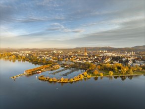 Aerial view of the city of Radolfzell on Lake Constance in autumn vegetation with the Waeschbruckhafen