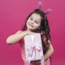 Cute girl bunny ears with gift box