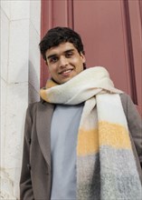 Medium shot smiley man with scarf