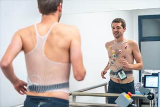 Man running while preforming a cardiovascular stress test in the hospital
