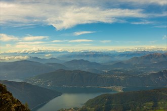 Aerial View over Beautiful Mountainscape with Clouds and Lake Lugano in a Sunny Day From Monte Generoso