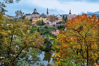 Old town with the castle above the Eger in autumn
