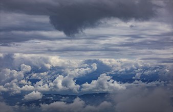 Dramatic cloudy sky on the Gerlitzen with a view of the Klagenfurt basin with the Pyramidenkogel observation tower