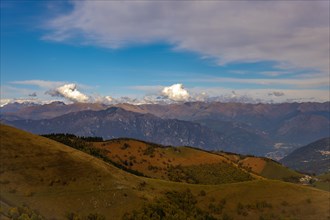 Aerial View over Beautiful Mountainscape with Clouds in a Sunny Day From Monte Generoso