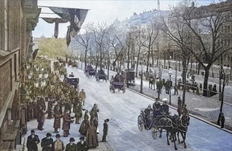 The Emperor leaving in a horse-drawn carriage in the street Unter den Linden in Berlin