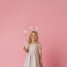 Cute little girl with wand copy space