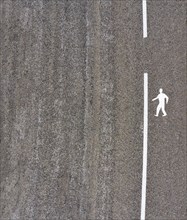 Drone view of a road marking of a pedestrian path on a road