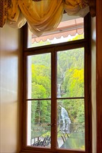 Grandhotel Giessbach with Window View over Giessbach waterfall in a Sunny Summer Day in Brienz