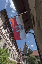 Waving Lauf town flag in the former Glockengiesser Spital