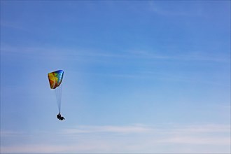 Tandem paragliding high in the sky