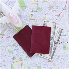Elevated view airplane passport banknotes map