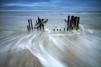 Remains of an old weathered groyne