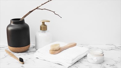 Brush towel moisturizing cream cosmetic bottle marble surface