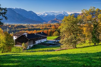 Autumn landscape with farm Perlach near the district Hagen with Zugspitzgruppe 2962m in the Wetterstein Mountains