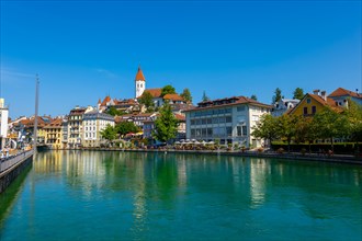 City of Thun and River Aare with Castle and Church in a Sunny Day in Bernese Oberland