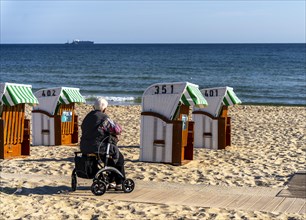 Senior citizen with rollator on the beach in the Baltic seaside resort of Baabe