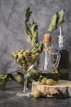 Front view glass filled with olives