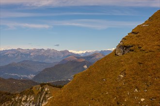Aerial View over Beautiful Mountainscape with Clouds in a Sunny Day in Valley in Ticino