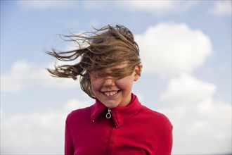 Portrait of a young girl in the wind