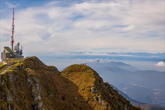 Aerial View over a Beautiful Meteorological and Communication Station on Mountain Peak and Mountainscape in a Sunny Day in Monte Generoso