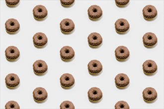 Bakery pattern with chocolate donuts