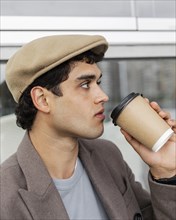 Close up man drinking coffee