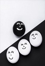 Flat lay different colored eggs with faces black lives matter movement