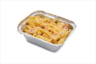 Mac and cheese with prosciutto in foil container isolated on white background