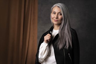 Beautiful senior woman portrait wearing black jacket 2