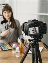 Female make up blogger with streaming with camera