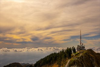 Aerial View over a Beautiful Meteorological and Communication Station with Trees on Mountain Peak and Cloudscape in Sunset in Monte Generoso