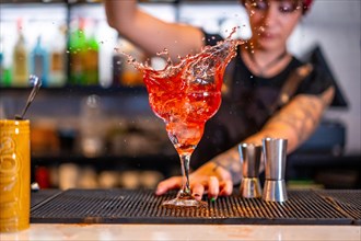 Motion scene of a bartender preparing a cocktail