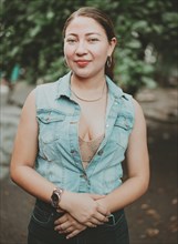 Portrait of attractive latin girl smiling outdoors. Portrait of Latin American girl face looking and smiling at the camera. Portrait of young Nicaraguan woman smiling at camera