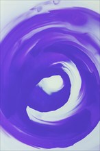 Close up purple smudges whirlpool abstract design