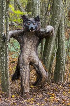 Scary werewolf puppet in forest