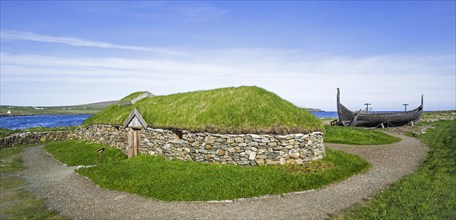 Reconstruction of Norse Viking longhouse and the Skidbladner